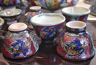 Okinawan fish on red guinomi sake cup