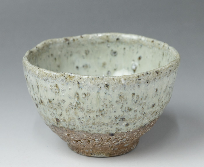 The side view of Madara Karatsu guinomi sake cup