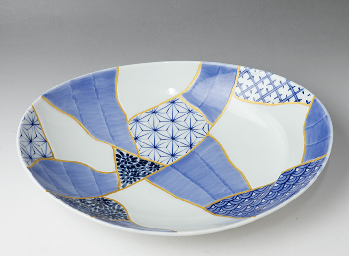 Oval bowl with Patchwork of Traditonal Patterns Design - top view